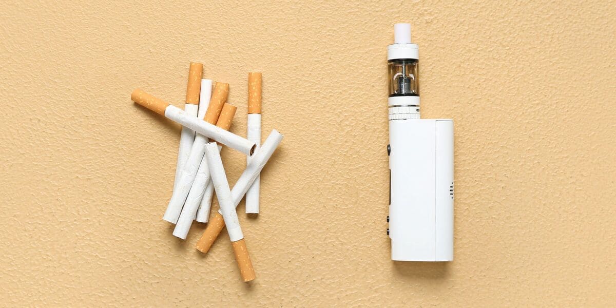 Person contemplating switching smoking to vaping, major life decision cigarette vs vape, smoker